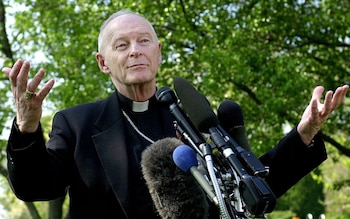 The then Cardinal McCarrick in 2002 speaks to reporters before leaving on a trip to the Vatican, where he planned to discuss the issue of sexual abuse in the Church with the Pope