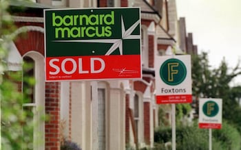 Estate agent signs on a London street