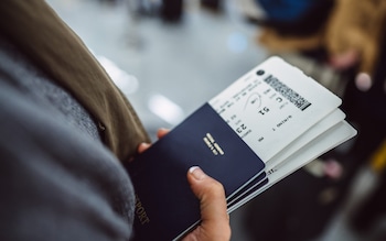 A person holding a passport 