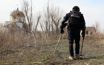 A Ukrainian sapper at work during demining operations in the Kharkiv area, northeastern Ukraine