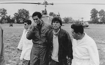 Álvaro Mangino, second right, following his rescue from the Andes in 1972