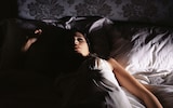 Woman lying in bed