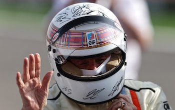 Bahrain International Circuit, Sakhir, Bahrain - April 13, 2025 Jackie Stewart is pictured wearing a helmet to be auctioned off to raise funds for Sir Jackie Stewart's Race Against Dementia charity after driving his 1973 title-winning Tyrrell ahead of the Bahrain Grand Prix
