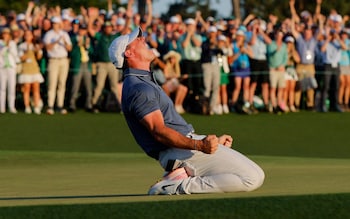 April 13, 2025 Northern Ireland's Rory McIlroy celebrates on the 18th green and 1st play-off hole after winning The Masters