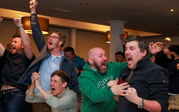 Members of Rory McIlroy's Holywood Golf Club in County Down, Belfast celebrate as he wins the US Masters 2025