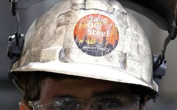 A Save our Steel sticker on the helmet of a worker at the British Steel site in Scunthorpe, Lincolnshire