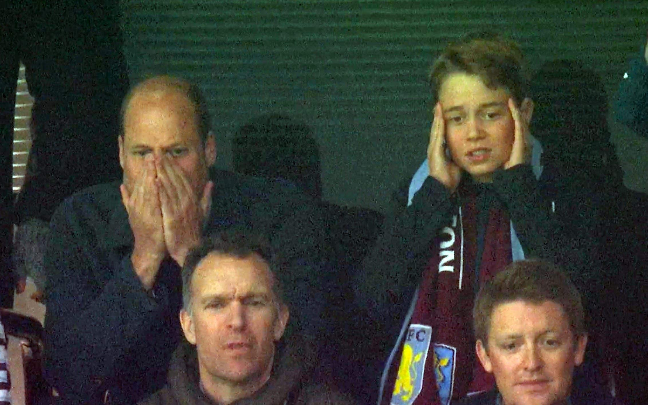 Princes William and George with their heads in hands watching Aston Villa