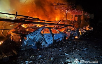 Firefighters work at the site of a Russian attack in Kamianske in Ukraine's Dnipro region on April 16