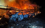 Firefighters work at the site of a Russian attack in Kamianske in Ukraine's Dnipro region on April 16